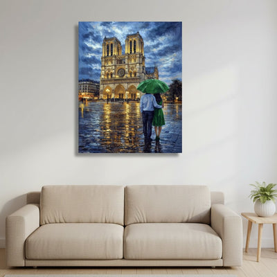 Canvas print of a couple with an umbrella under Notre-Dame Cathedral in Paris, hanging above a beige sofa.